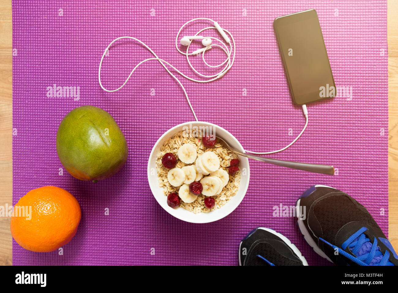 Oatmeal with fruits after a workout . Fitness and healthy lifestyle
