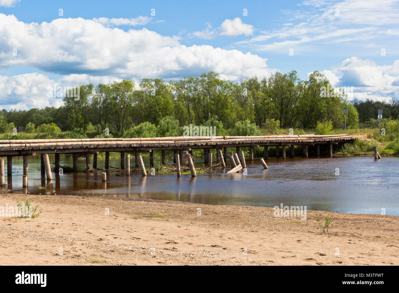 Wooden road bridge near the village of Klopovskaya, Velsky district, Arkhangelsk region, Russia Stock Photo