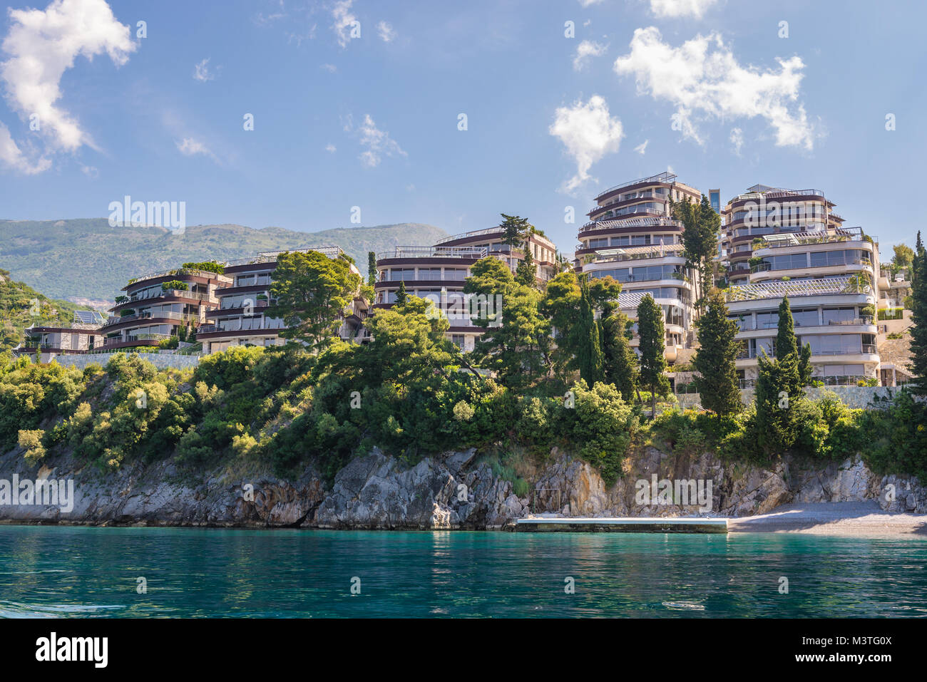 Dukley Gardens Residential Complex on Zavala Peninsula in Budva city on the coast of Adriatic Sea in Montenegro Stock Photo