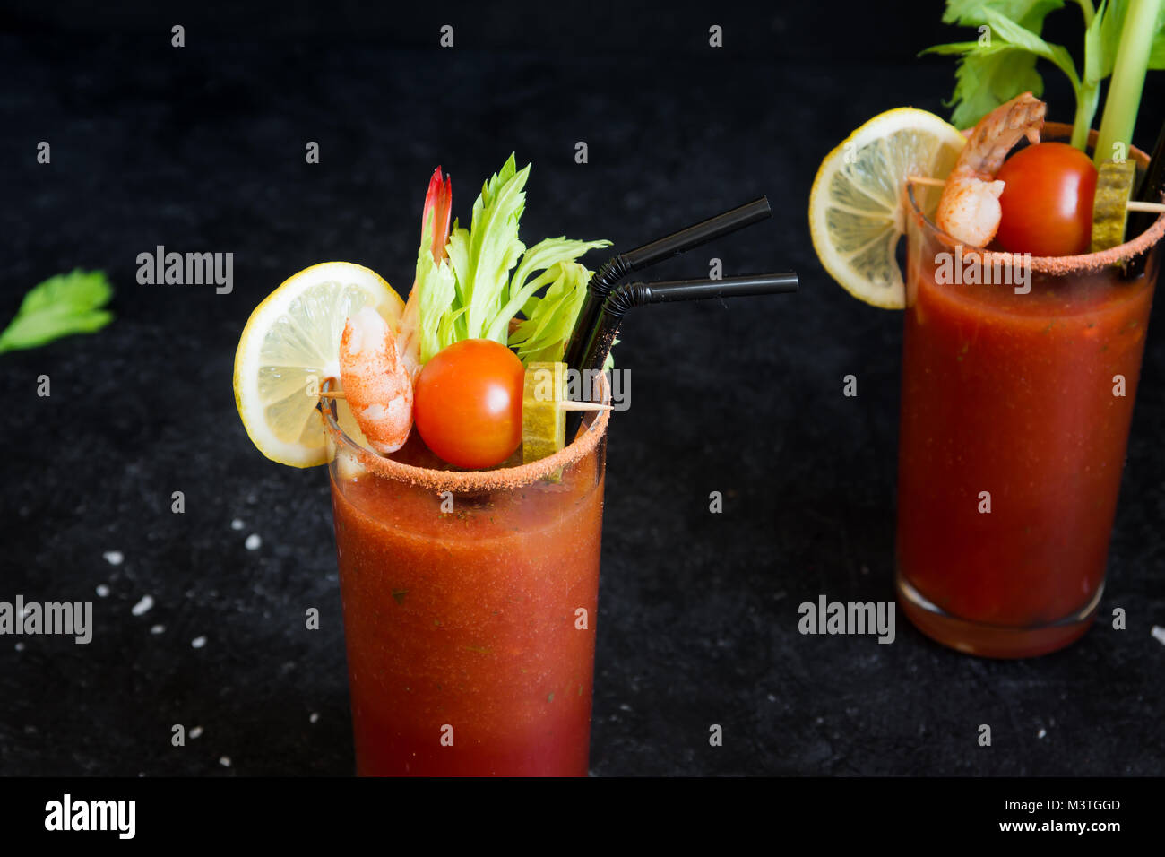 Bloody Mary Cocktail in glasses with garnishes. Tomato Bloody Mary
