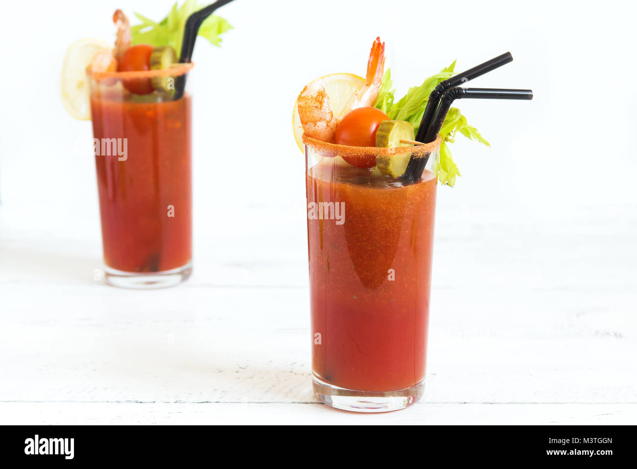 Bloody Mary Cocktail in glasses with garnishes. Tomato Bloody Mary