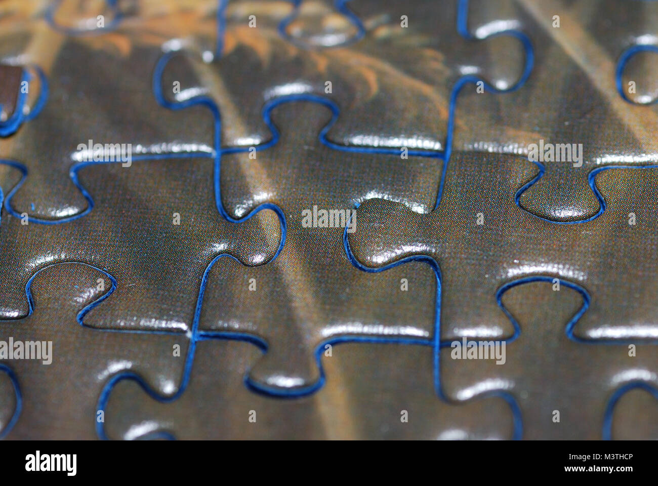 detailansicht puzzle with brown stones with blue fringe Stock Photo