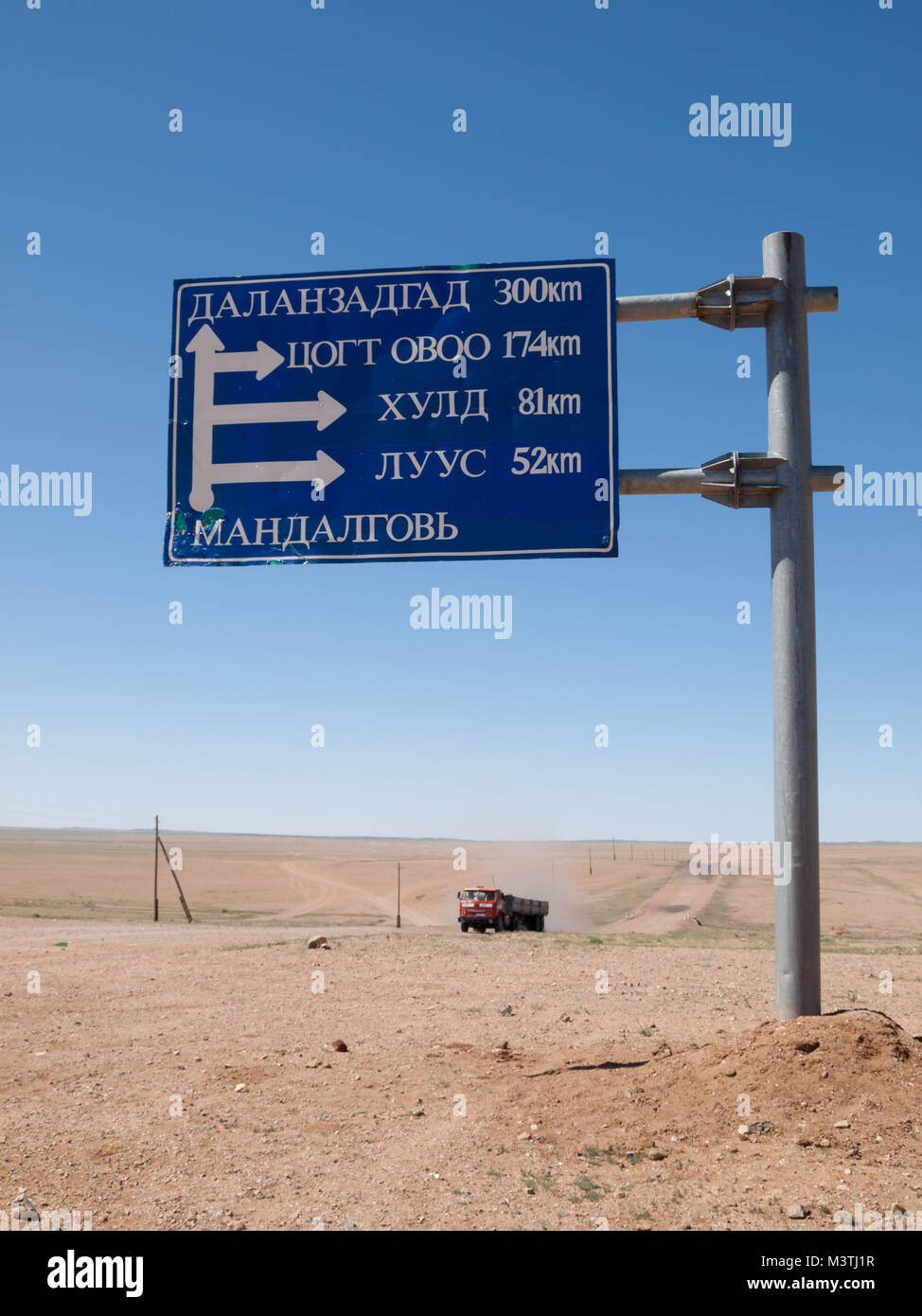 Truck by Mongolian dirt road sign Stock Photo