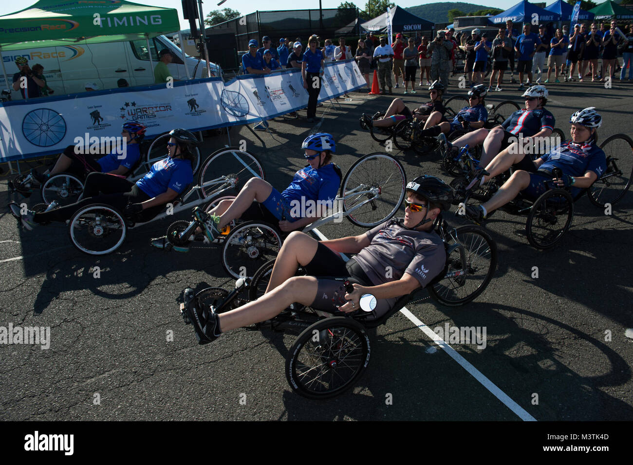 Recumbent cyclists begin their race at the cycling course starting line