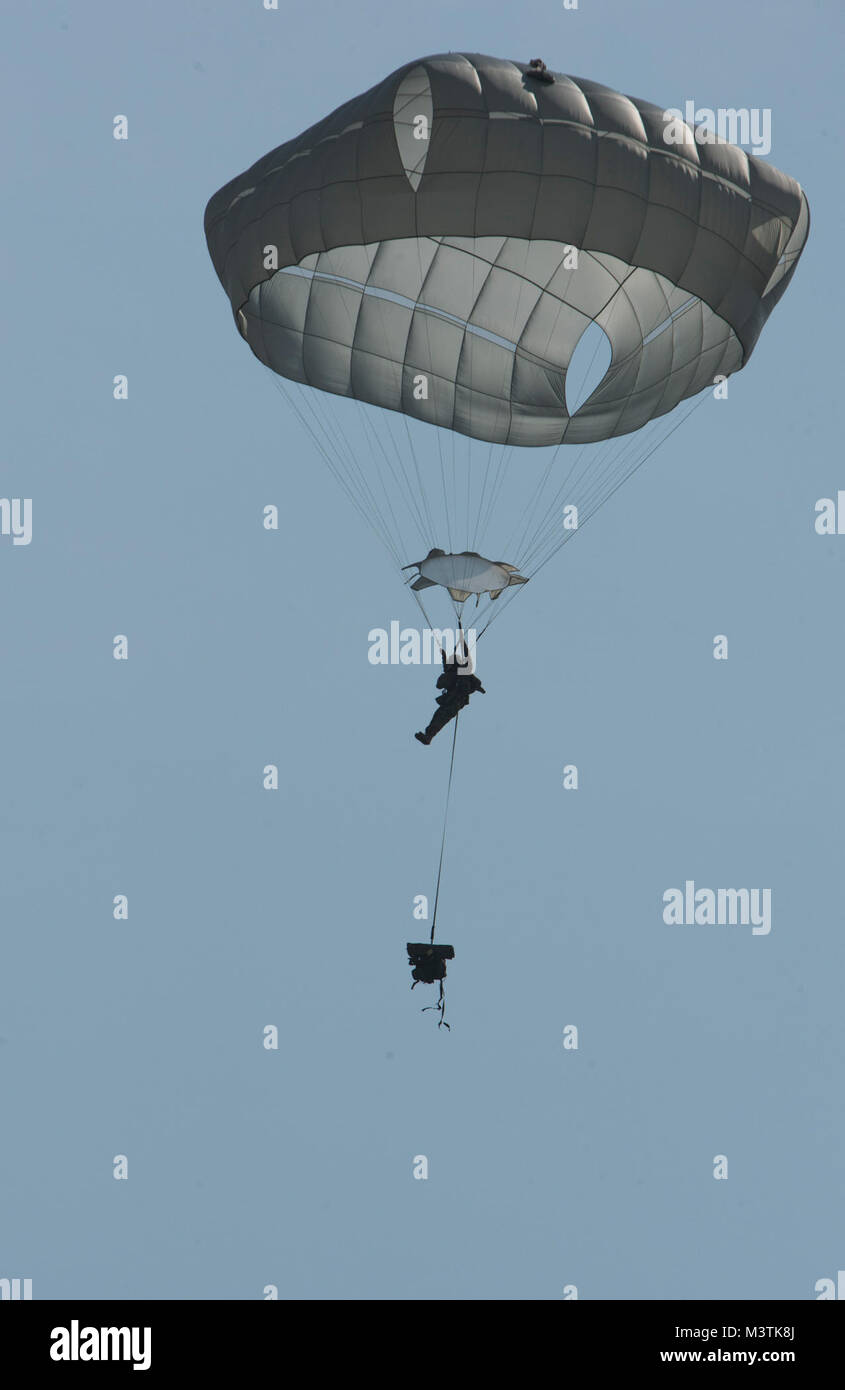 A U.S. Army Paratrooper, with the 82nd Airborne Division, parachutes ...