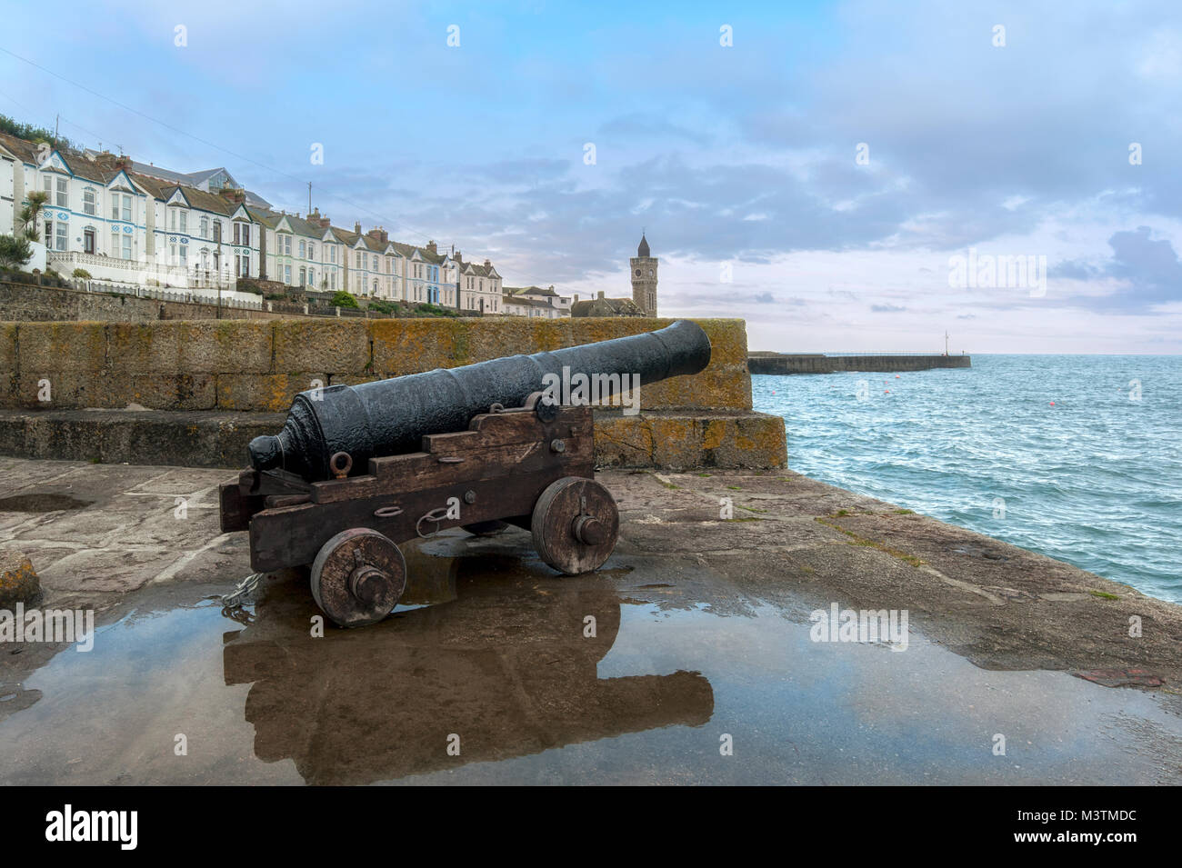 PORTHLEVEN, CORNWALL - JUNE 10, 2009:  Old Naval guns on the Harbour walls Stock Photo