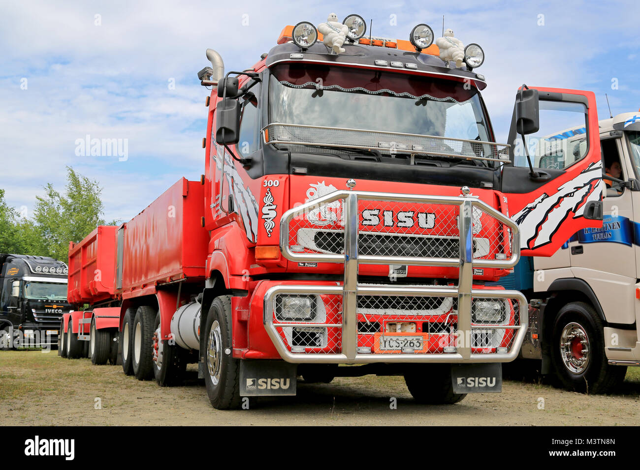 HATTULA, FINLAND - JULY 12, 2014: Red Sisu construction trailer truck with large bull bar on display at Tawastia Truck Weekend in Hattula, Finland. Stock Photo