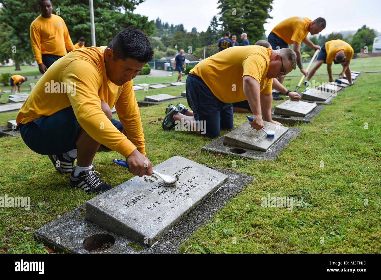 160816-N-OO032-026 BREMERTON, Wash. (Aug. 16, 2016) – Chief Aviation Maintenance Administrationman (Select) Dylar McCulley (left), from Kenmore, Washington, and stationed with USS Nimitz (CVN 68), cleans a head stone alongside fellow Pacific Northwest chief petty officer selects during a community relations event at Ivy Green Cemetery as part of the USS Turner Joy (DD 951) Legacy Academy. The academy entails living aboard the Vietnam-era destroyer while participating in community relation projects, ship preservation, leadership training, and a naval heritage capstone project. The Turner Joy is Stock Photo