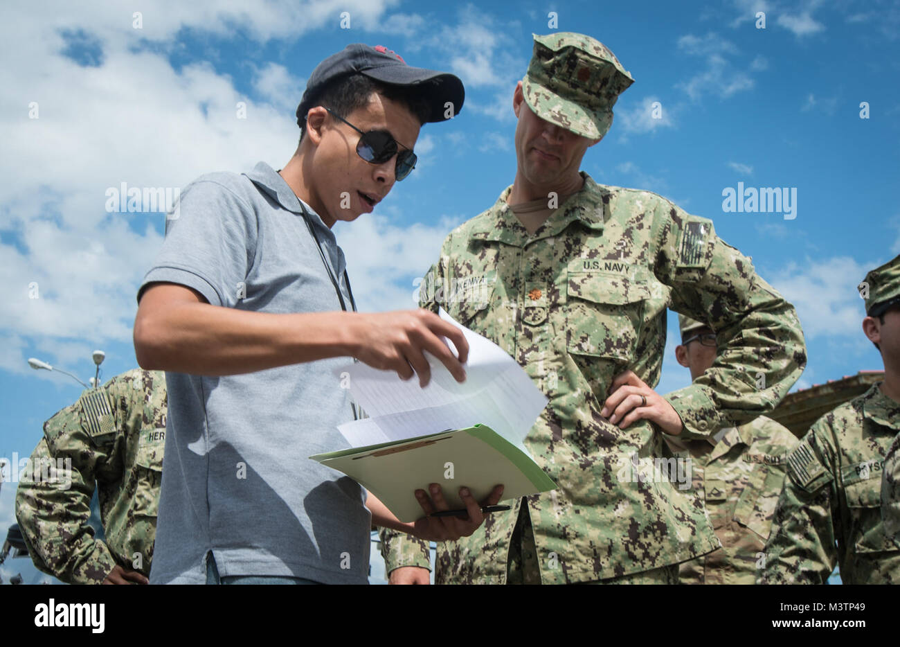 160824-N-CJ186-0081  SAN PEDRO SULA, Honduras (Aug. 24, 2016) – U.S. Navy Lt. Cmdr. Patrick McKenna, a preventive medicine officer assigned to Naval Environmental Preventive Medicine Unit 2, accepts a shipment of water and emergency rations to be donated to Operation Blessing during Southern Partnership Station 2016 (SPS-16). SPS-16 is an annual series of U.S. Navy deployments focused on subject matter expert exchanges with partner nation militaries and security forces in Central and South America and the Caribbean. U.S. military teams work with partner nation forces during naval-focused train Stock Photo