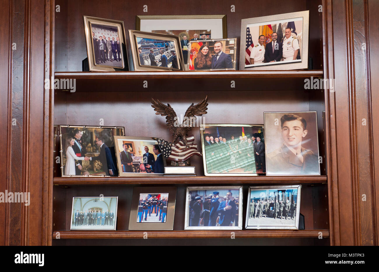 A display of U.S. Military memorabilia and family photos sits on a