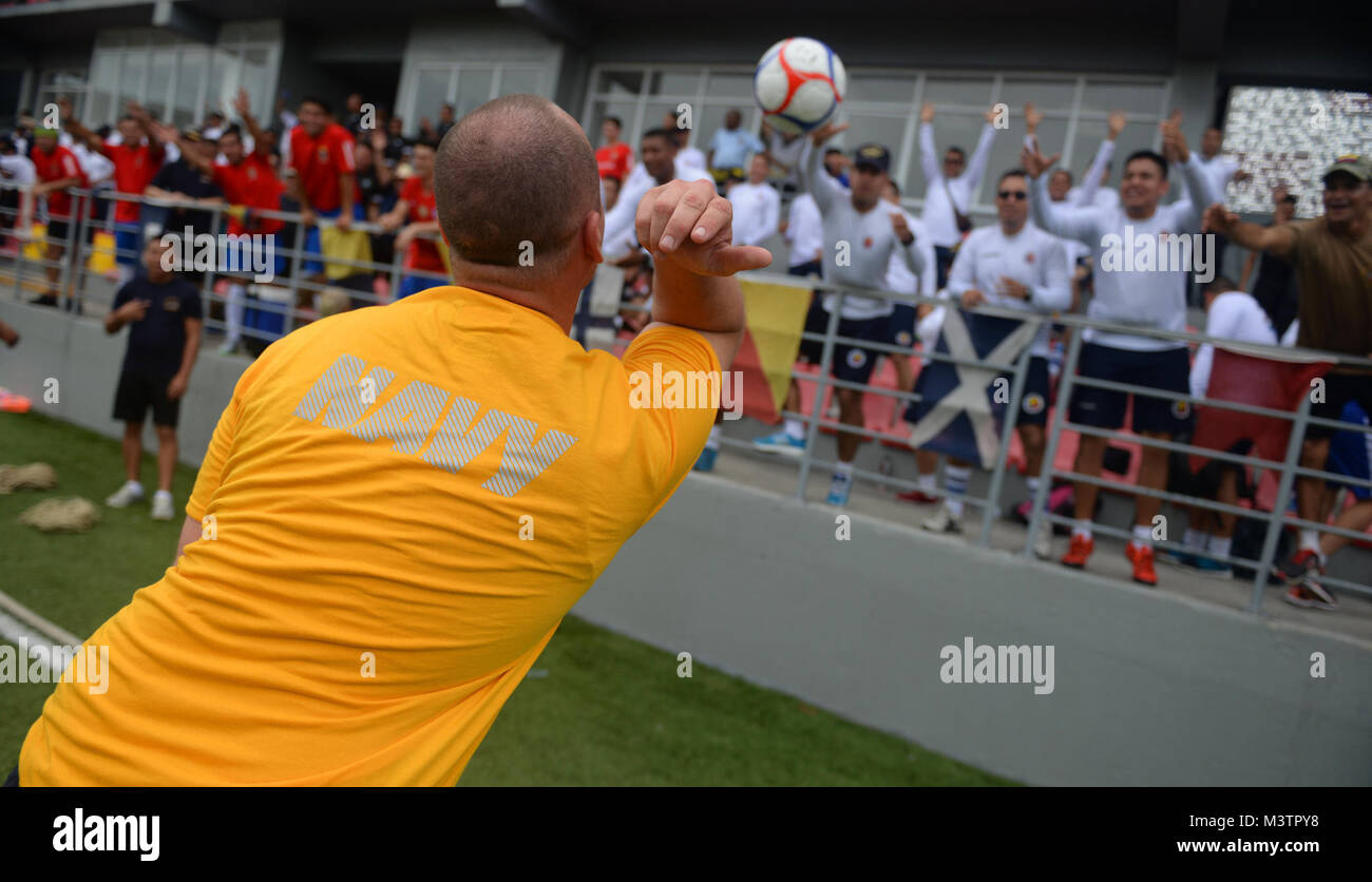 PANAMA CITY, Panama (Sept. 20, 2016) - Master At Arms 3rd Class Anthony Ford, a Sailor assigned to USNS Spearhead (T-EPF-1), tosses soccer balls into the crowd of UNITAS partner nations during a day of sports at the Estadio Maracaná de Panamá soccer stadium. UNITAS is an annual multi-national exercise that focuses on strengthening our existing regional partnerships and encourages establishing new relationships through the exchange of maritime mission-focused knowledge and expertise throughout the exercise. (U.S. Navy Photo by Mass Communication Specialist 1st Class Jacob Sippel/RELEASED) 16092 Stock Photo