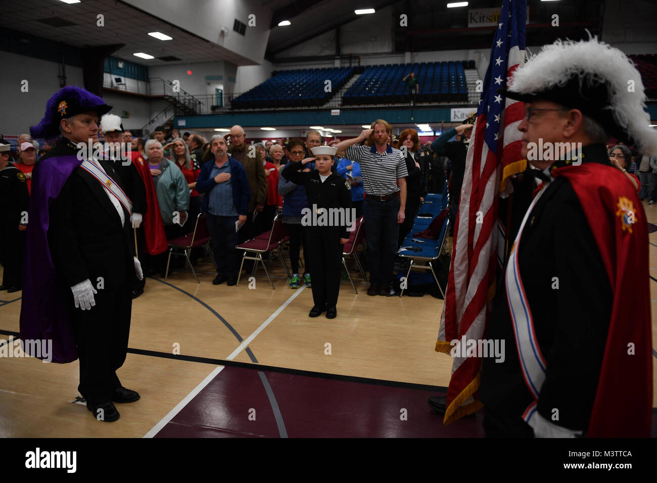 161111-N-EC099-133 SILVERDALE, Wash. (Nov. 11, 2016) Members of the Knights of Columbus, Naval Sea Cadet Corps and Navy Jr. Reserve Officer Training Corps color guards parade the colors during the 2016 Veterans Day ceremony held in the Kitsap Sun Pavilion. The ceremony paid respect to service members both past and present and remembered those service members lost during the history of the United States. (U.S. Navy photo by Petty Officer 3rd Class Charles D. Gaddis IV/Released) 161111-N-EC099-133 by Naval Base Kitsap (NBK) Stock Photo