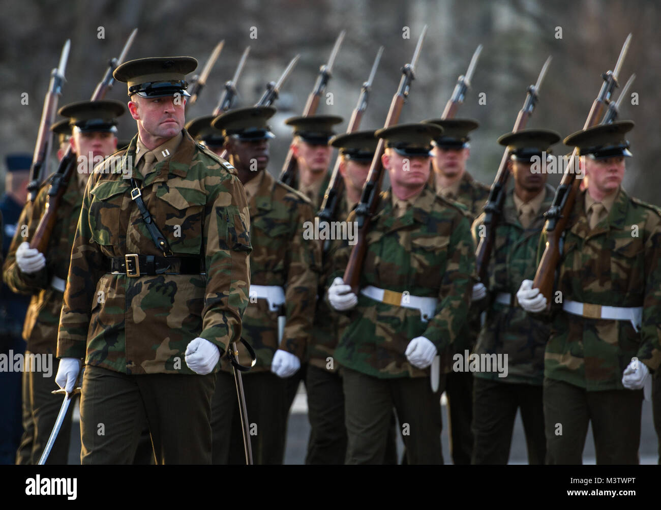 The United States Marine Corps Honor Guard march during pass and review at the Department of Defense 58th Presidential Inauguration Dress rehearsal in Washington, D.C., Jan. 15, 2017. More than 5,000 military members from across all branches of the armed forces of the United States, including reserve and National Guard components, provided ceremonial support and defense support of civil authorities during the inaugural period. (DoD photo by U.S. Air Force Staff Sgt. Marianique Santos) 170115-D-NA975-0532 by AirmanMagazine Stock Photo