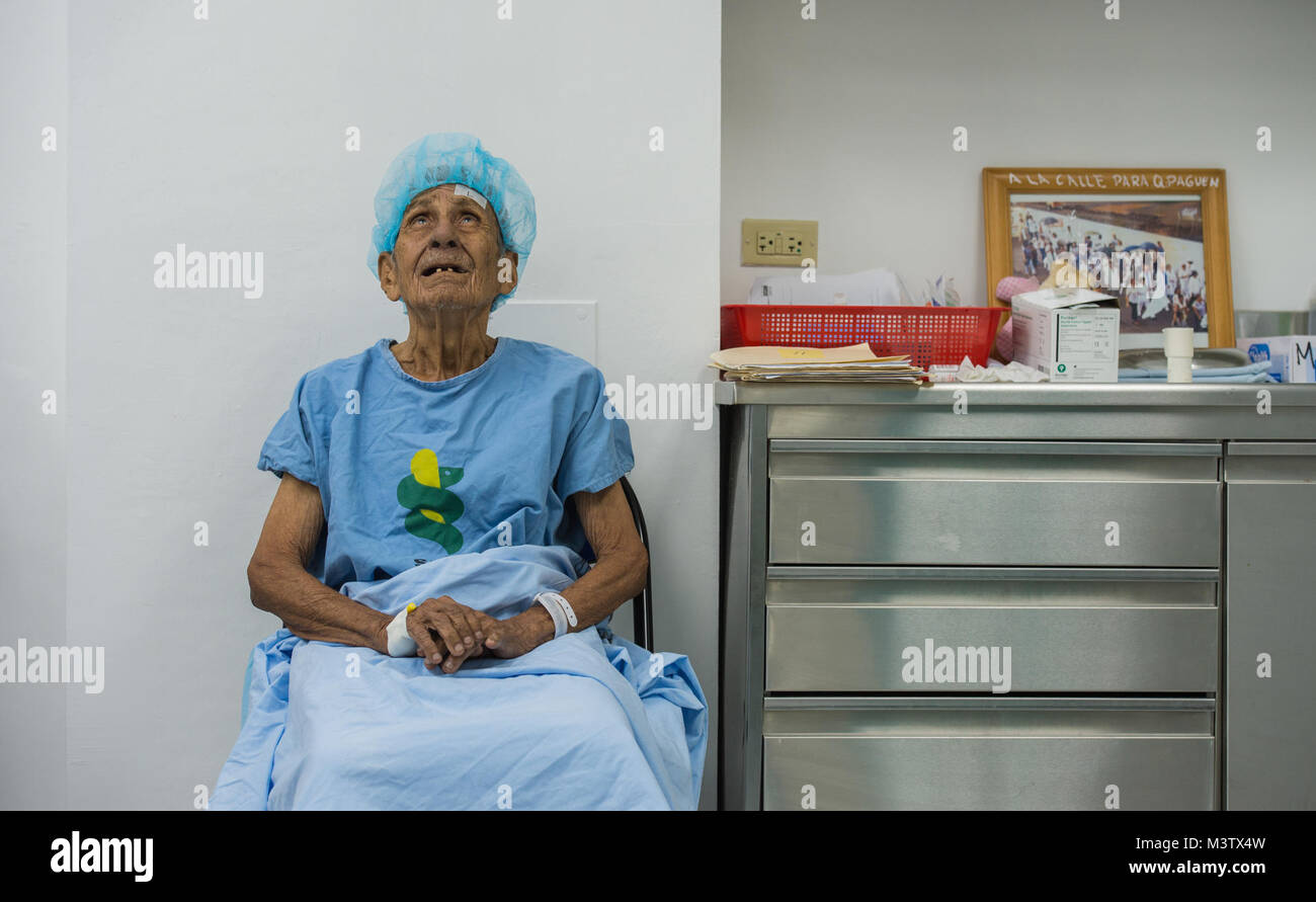A cataract surgery patient looks up in prayer during his pre-operation examination at the Centro Hospitalario Luis 'Chicho' Fabrega, Santiago, Panama, Feb. 6, 2017. A U.S. military medical team was in Panama to help treat individuals with cataracts that otherwise would have gone untreated. Medical readiness training exercises provide U.S. military personnel training in delivery of medical care in austere conditions, promote diplomatic relations between the U.S. and host nations in Central America and provide humanitarian and civic assistance via a long-term proactive program. These exercises b Stock Photo