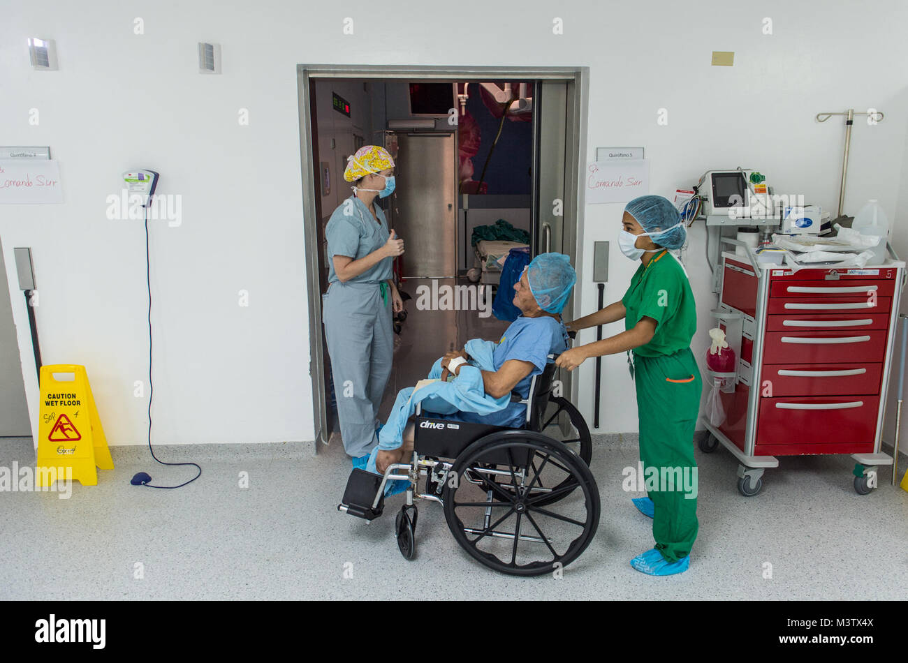 U.S. Army Maj. Erin Seefeldt, an ophthalmologist, gives a thumbs-up to a surgery patient after his extracapsular cataract extraction with intraocular implant surgery at the Centro Hospitalario Luis 'Chicho' Fabrega during a medical readiness training exercise in Santiago, Panama, Feb. 6, 2017. The U.S. military medical team was in Panama to help treat individuals with cataracts that otherwise would have gone untreated. Medical readiness training exercises provide U.S. military personnel training in delivery of medical care in austere conditions, promote diplomatic relations between the U.S. an Stock Photo