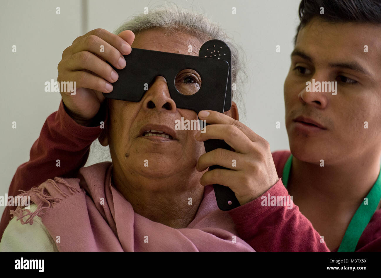A post operation patient tries to read an eye chart, Feb. 7, 2017, after having an extracapsular cataract extraction with intraocular implant surgery at the Centro Hospitalario Luis 'Chicho' Fabrega during a medical readiness training exercise in Santiago, Panama. A U.S. military medical team was in Panama to help treat individuals with cataracts that otherwise would have gone untreated. Medical readiness training exercises provide U.S. military personnel training in delivery of medical care in austere conditions, promote diplomatic relations between the U.S. and host nations in Central Americ Stock Photo
