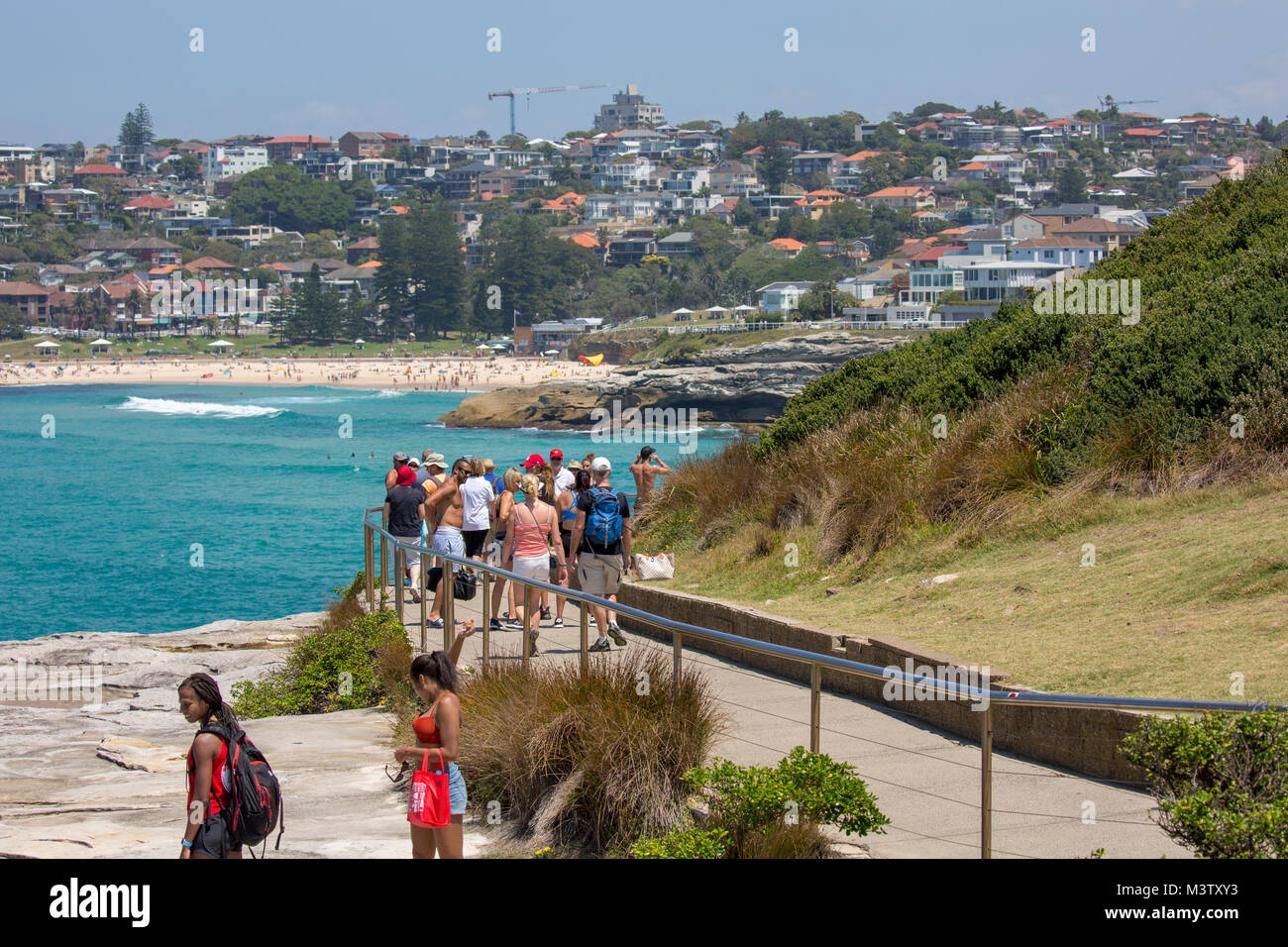 People walking the coastal path between Bondi beach and Bronte beach in Sydney eastern suburbs, New South Wales,Australia Stock Photo