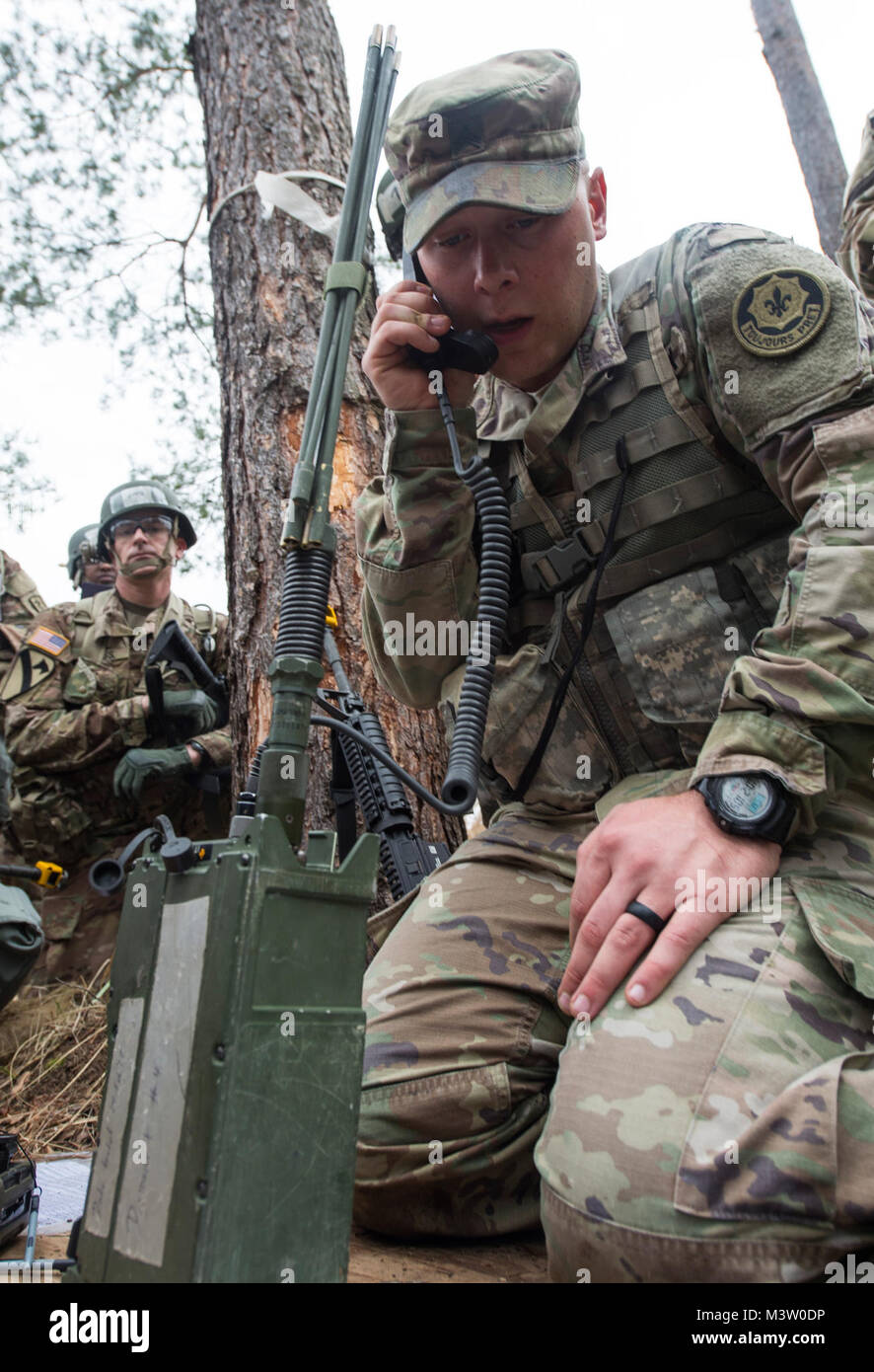 GRAFENWOEHR, Germany – U.S. Army Sergeant Ryne Johnson makes radio  communication with a RT15 23 radio during the demonstration portion of a U.S.  Army Europe Expert Field Medical Badge evaluation in Grafenwoehr,
