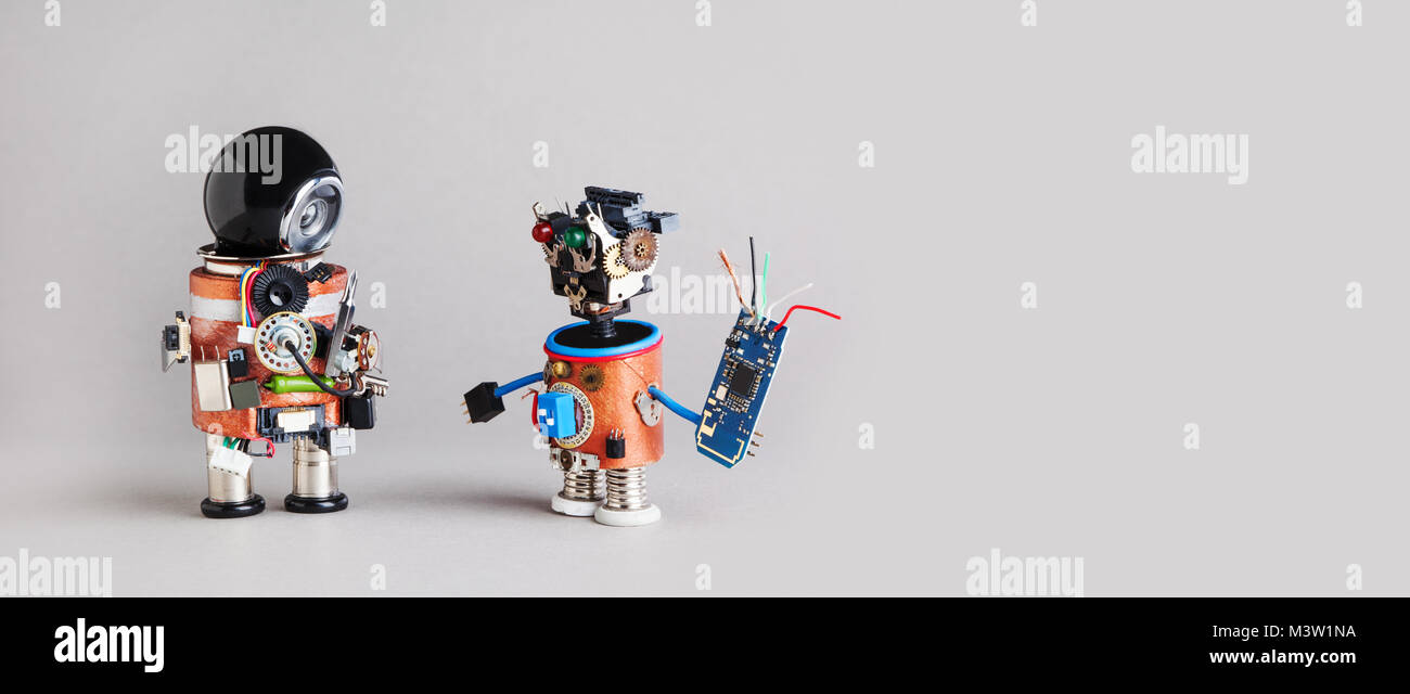 Industry 4.0 service repair maintenance concept. Creative design robotic handyman characters on gray background Stock Photo