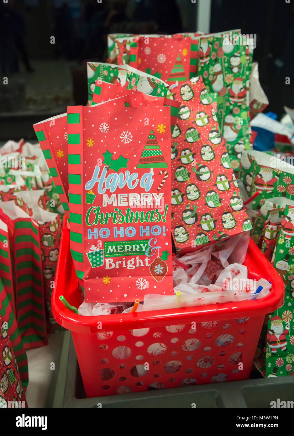 Christmas gift wrapping bags and paper Stock Photo Alamy