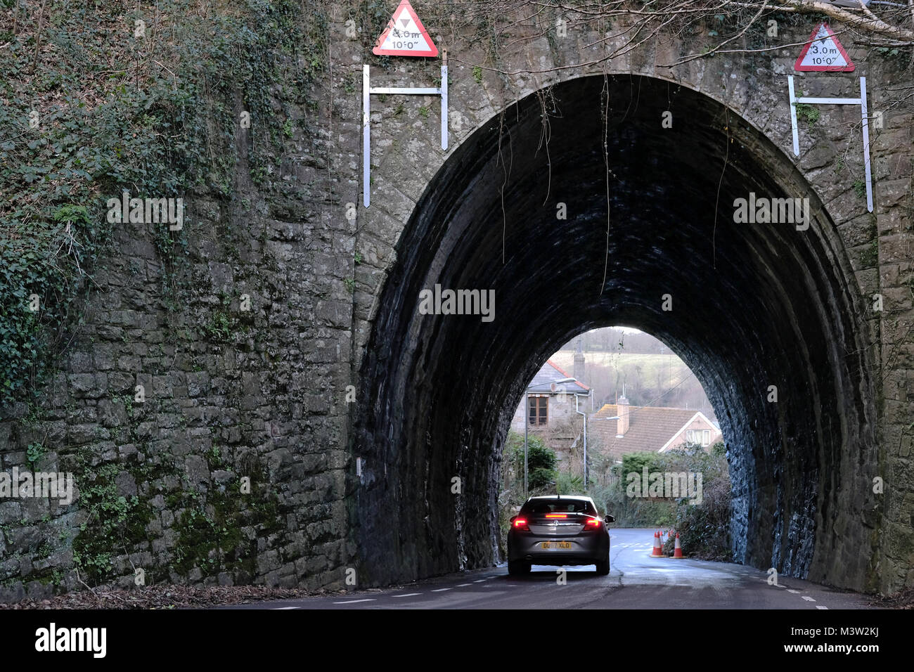 A road underneath a railway bridge Stock Photo