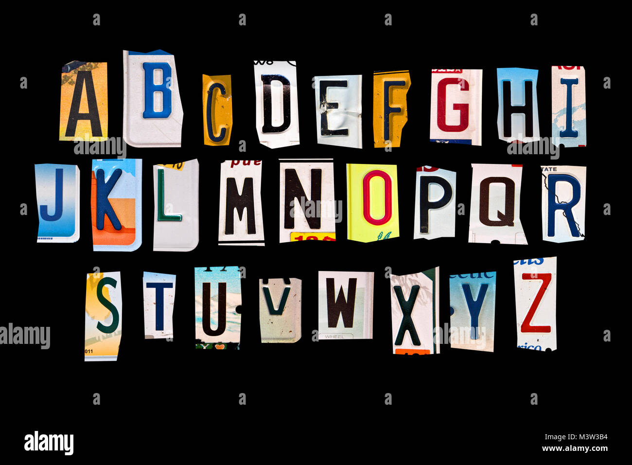 Alphabet set created with broken pieces of vintage car license plates Stock Photo