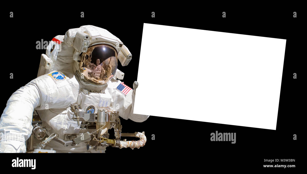 Astronaut in space holding a white blank board - elements of this image are provided by NASA Stock Photo