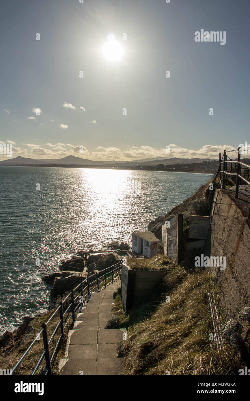 Steps down to Vico Bathing Place; coupled with a view of Killiney Bay. Stock Photo
