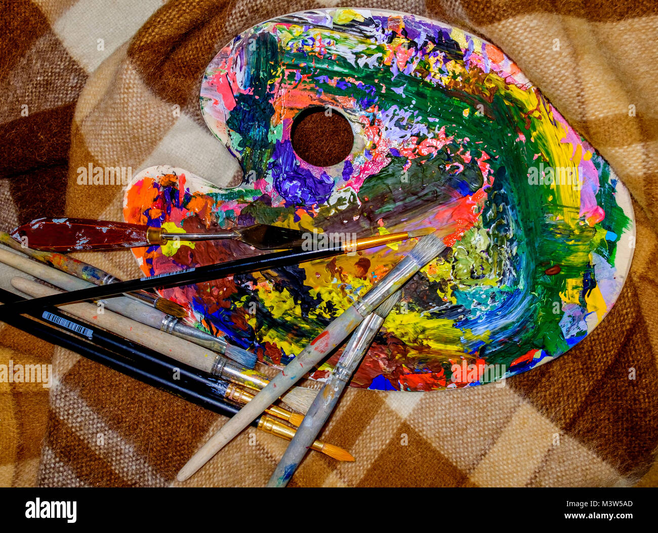 Colorful palette with old brushes and paletteknife Stock Photo Alamy