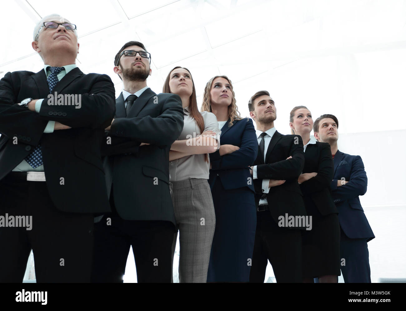 bottom view. successful business team standing together Stock Photo - Alamy