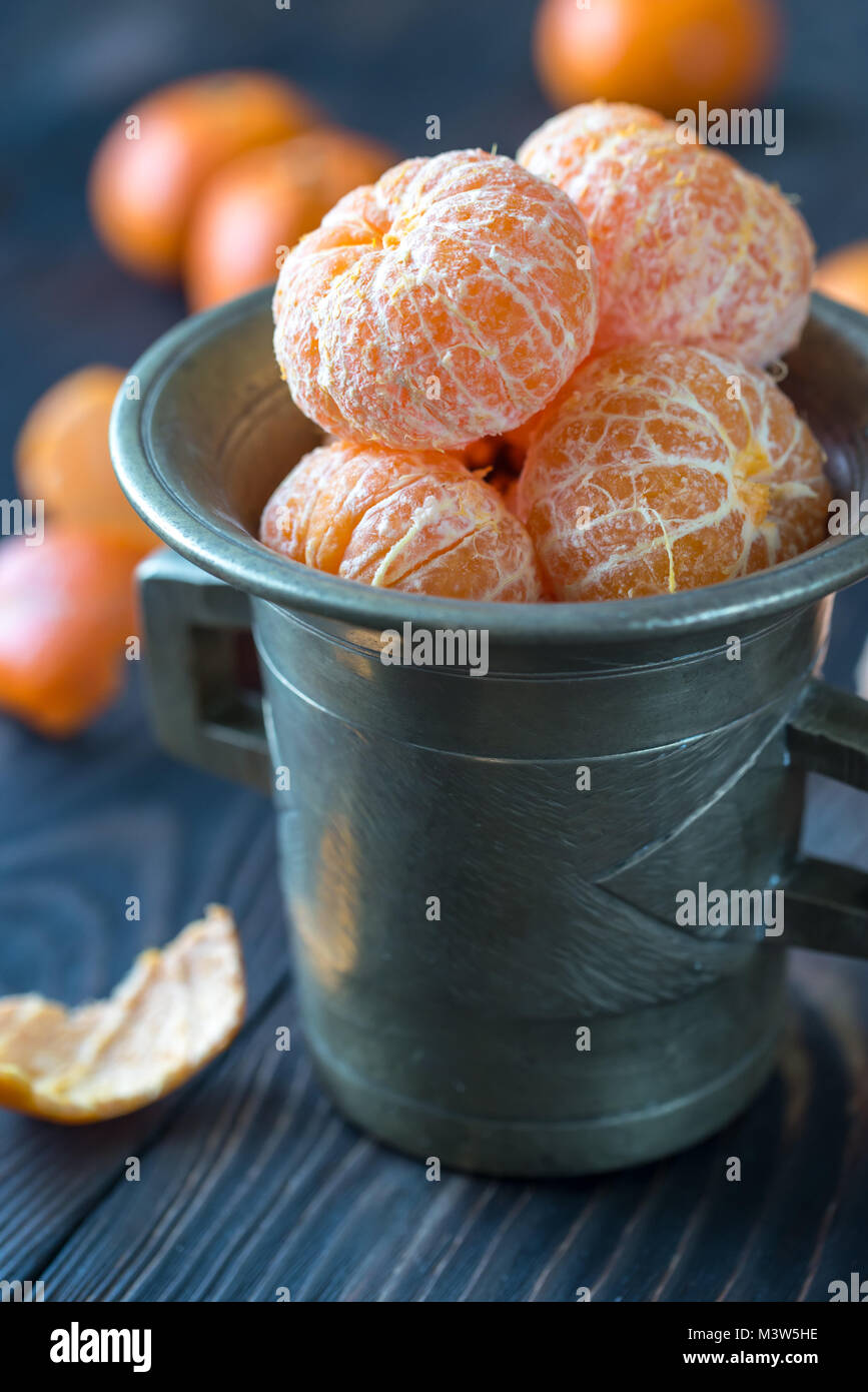 Peeled tangerines in the vintage cup Stock Photo Alamy