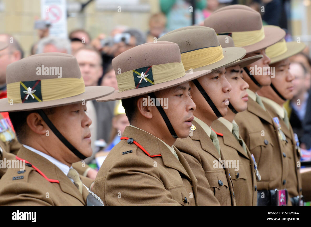 Gurkha soldiers of the British Army marching out of Windsor Castle during ceremony celebrating Queen Elizabeth's Diamond Jubilee Armed Forces Parade Stock Photo