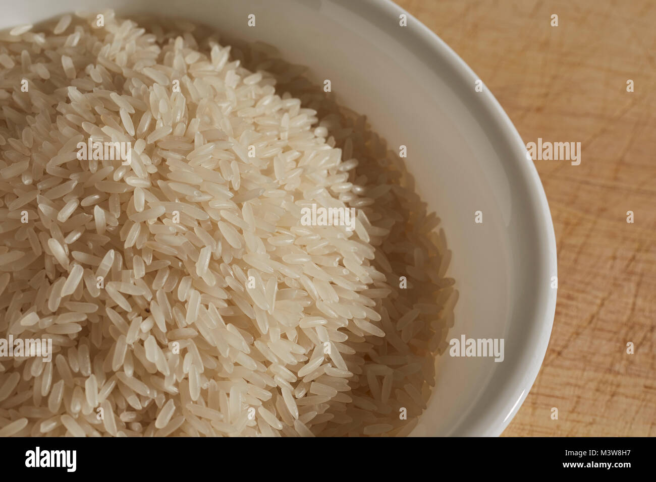 uncooked white jasmine rice from Thailand Stock Photo