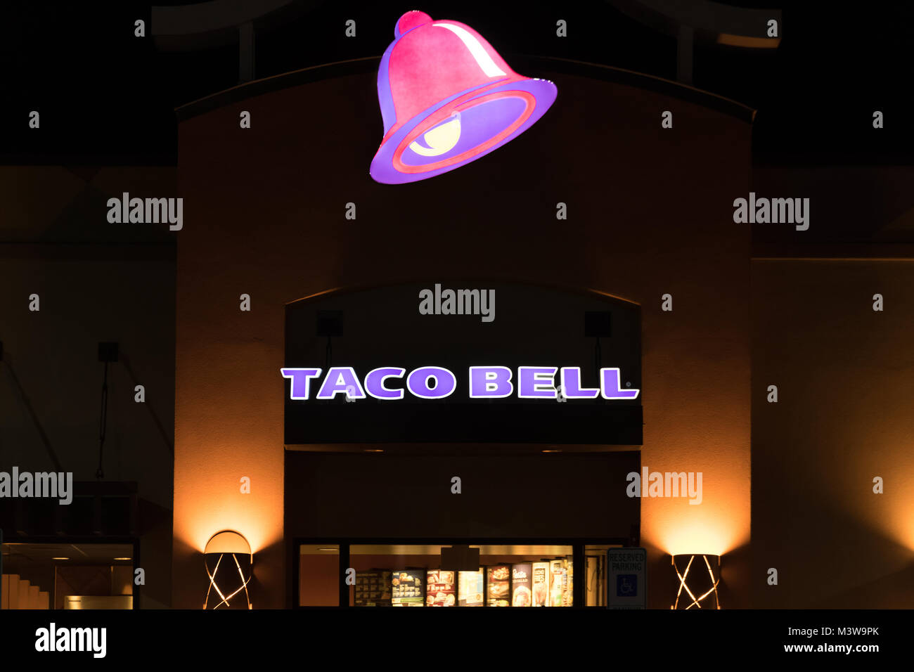 WILSON, NC - JANUARY 25, 2018: A Taco Bell restaurant entrance at night. Taco Bell is an American chain of fast food restaurants based out of Irvine,  Stock Photo