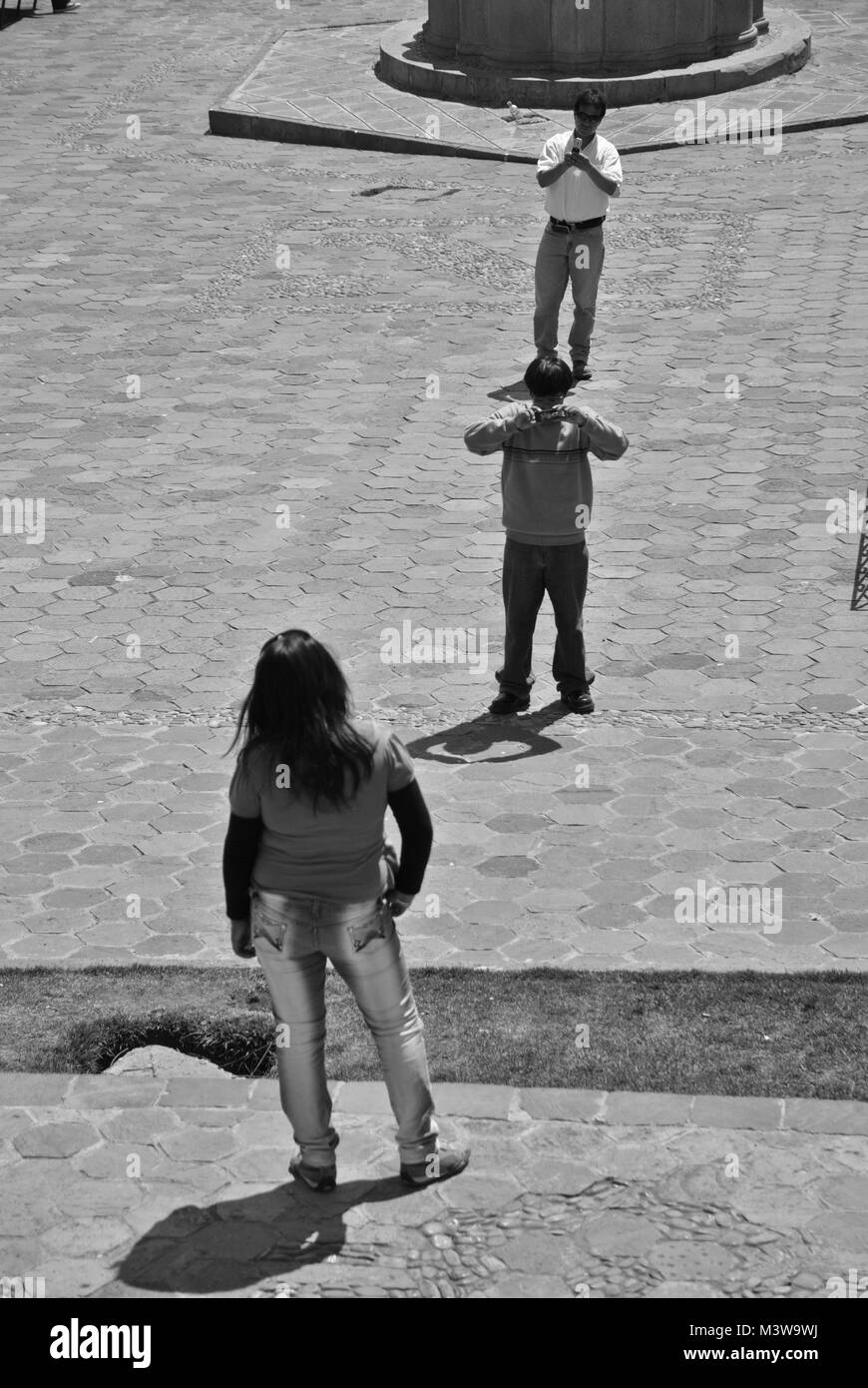 Black and white photo of a woman posing for a photograph in Cuzco, Peru Stock Photo