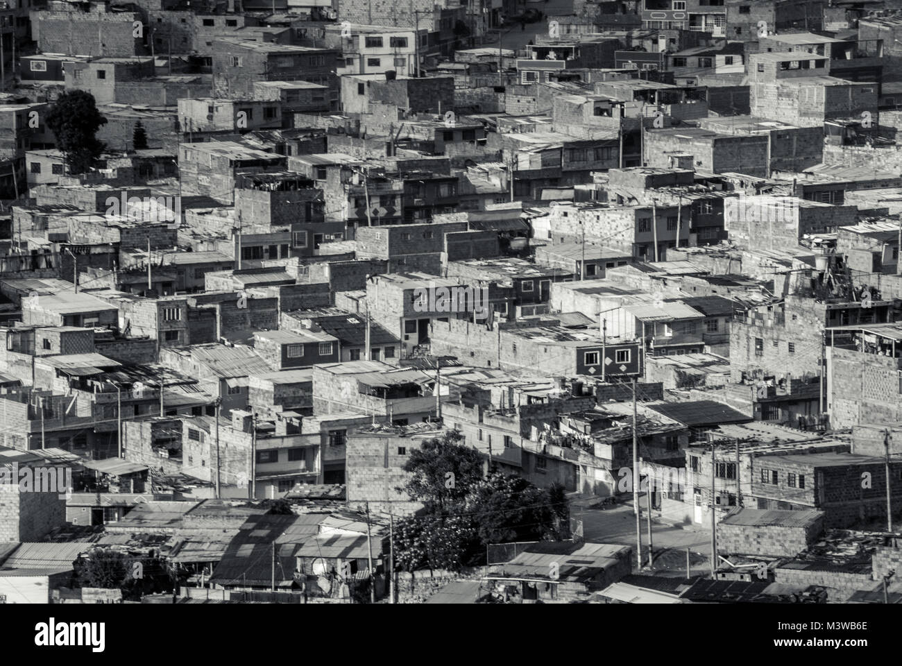 A black and white close-up photo of the buildings of a shanty town in Bogota, Colombia Stock Photo