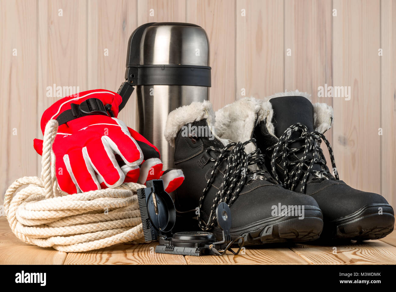 objects for winter extreme trekking on a wooden background Stock Photo