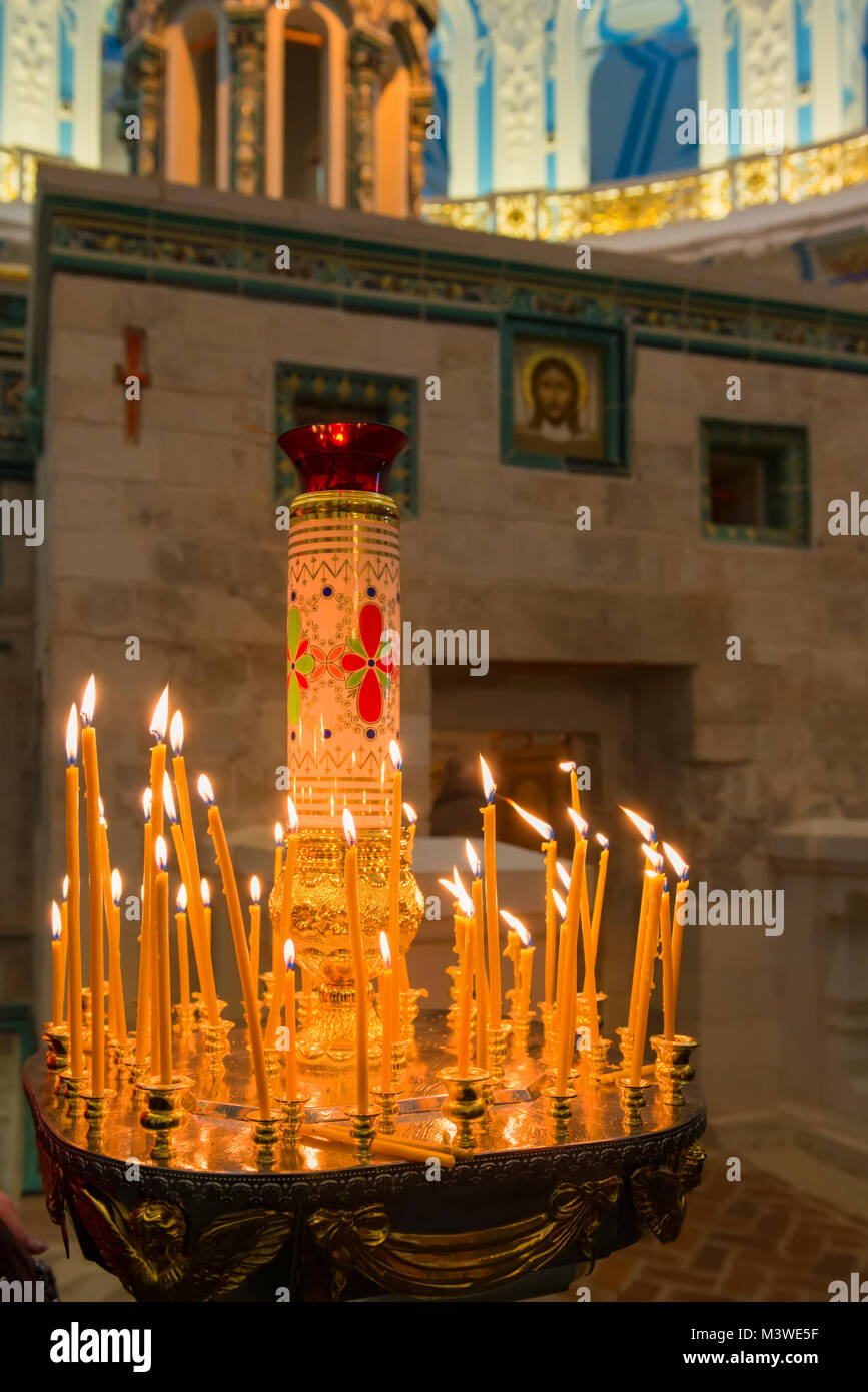 ISTRA, RUSSIA - JANUARY 3, 2017: Candles near chapel of the Holy Sepulchre in the Voskresensky New-Jerusalem Stavropegial male monastery, Istra, Mosco Stock Photo