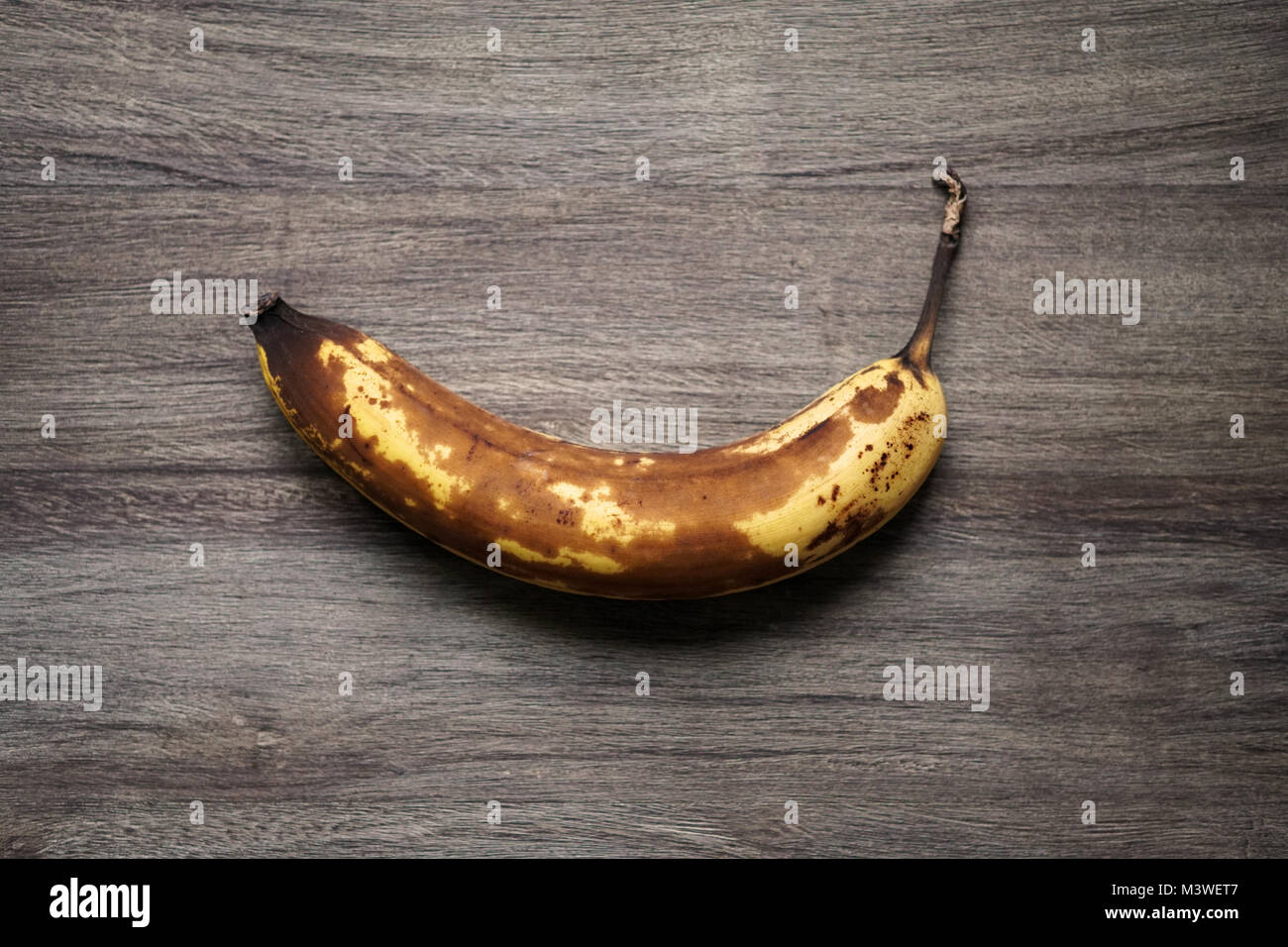 overrripe banana with brown skin Stock Photo