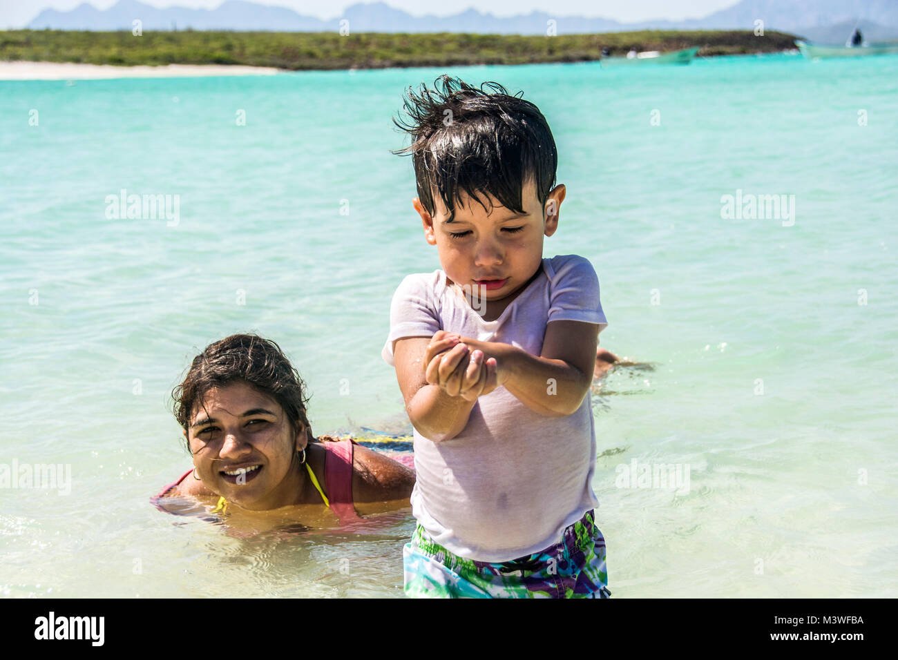 Mother and son playing in the water: Isla Coronado (Coronado Island) Stock Photo
