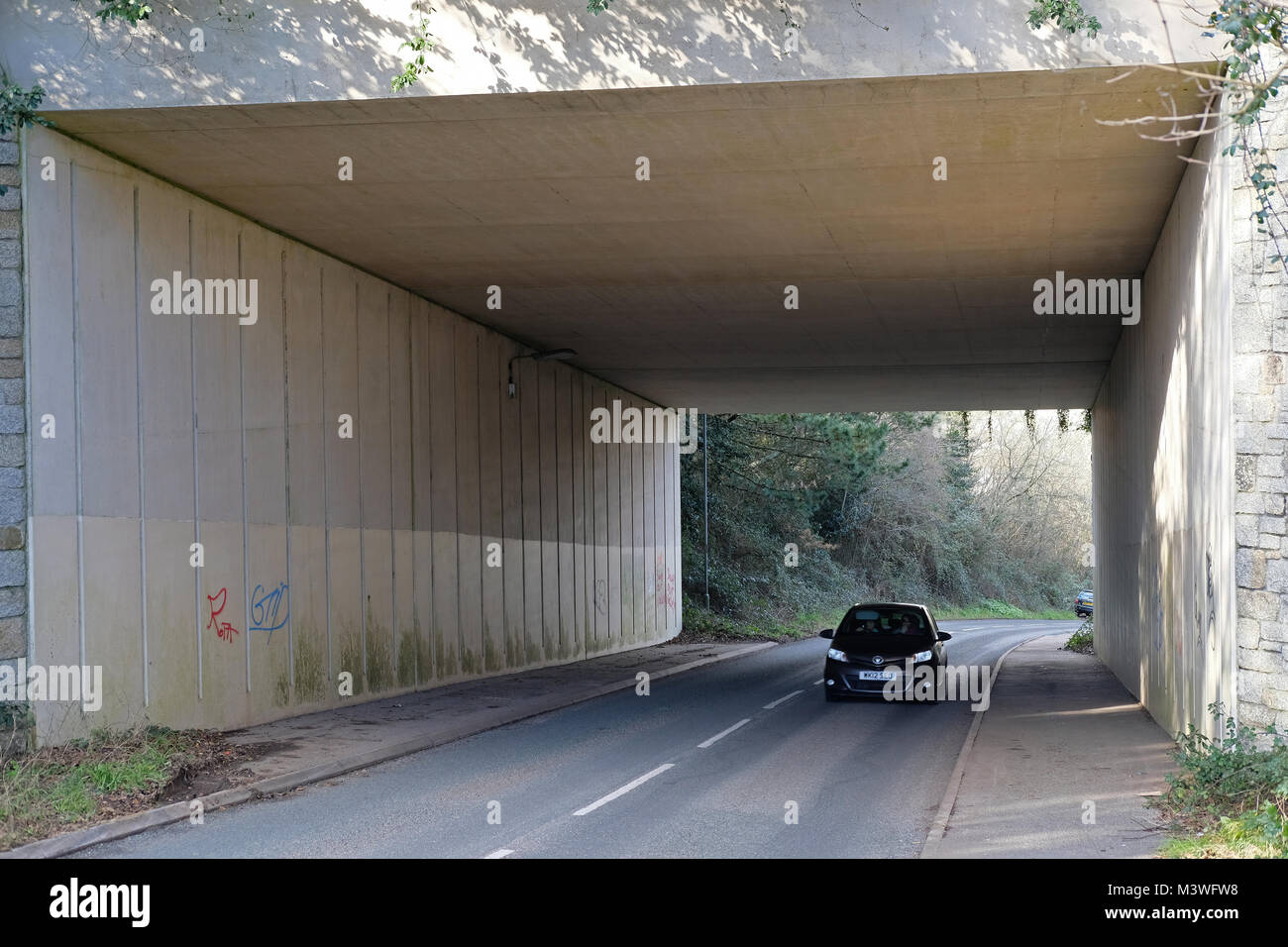 A car driving through an underpass Stock Photo