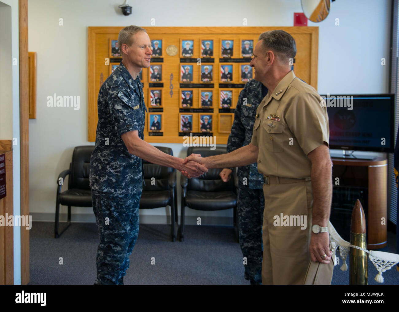 BANGOR, Wash. (June 22, 2017) Capt. Ted Schroeder, chief of staff, Submarine Group (COMSUBGRU) 9, greets Chief of Naval Personnel Vice Adm. Robert Burke on the quarterdeck of COMSUBGRU-9 while visiting Naval Base Kitsap (NBK) Bangor. During his visit, he conducted four separate all hands calls at NBK Bangor and NBK Bremerton to answer Sailor’s questions. (U.S. Navy photo by Mass Communication Specialist 1st Class Amanda R. Gray/Released) 170622-N-UD469-011 by Naval Base Kitsap (NBK) Stock Photo