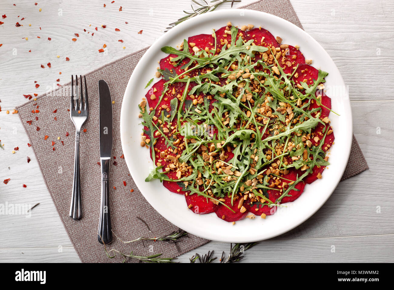 beets with peanuts on white wooden background, breakfast Stock Photo