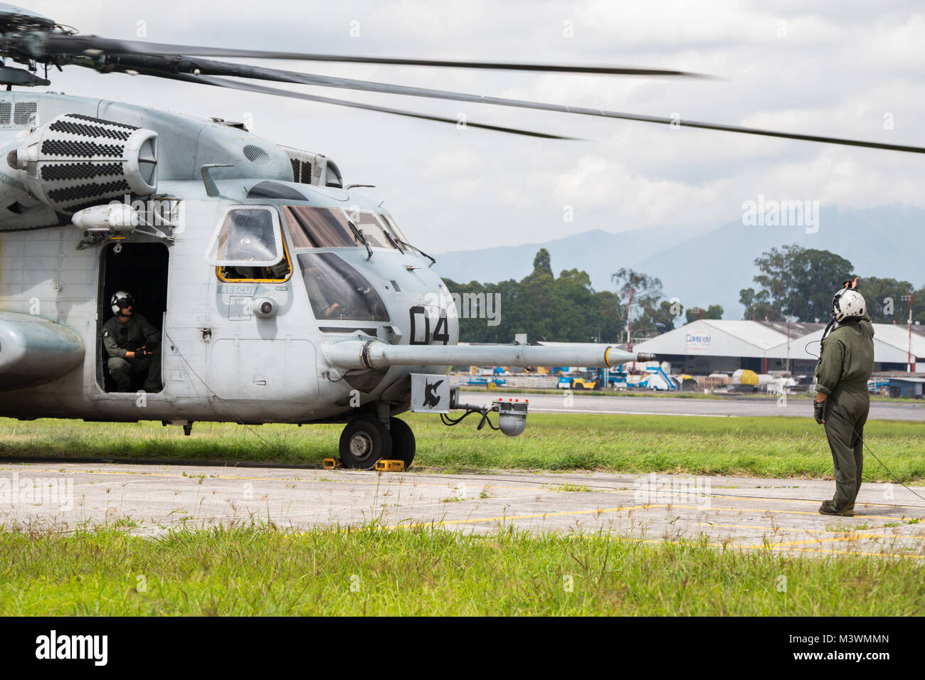 U.S. Marines with the Aviation Combat Element, Special Purpose Marine Air-Ground Task Force - Southern Command, prepare their CH-53E Super Stallion helicopter for takeoff from La Aurora International Airport in Guatemala City, Guatemala, Aug. 1, 2017. The ACE will be operating in Guatemala during the month of August to test the unit’s ability to operate away from their primary base and better support the other elements of the task force. The Marines and sailors of SPMAGTF-SC are deployed to Central America to conduct security cooperation training and engineering projects with their counterpart Stock Photo