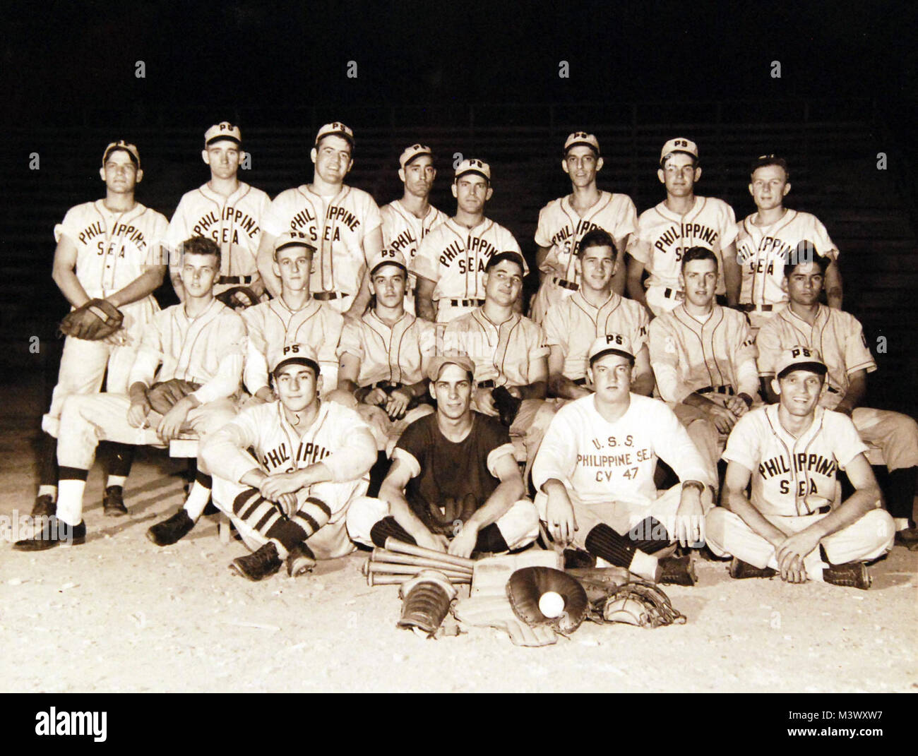 80-G-409016:  USS Philippine Sea (CVA-47), Baseball Team, at Guantanamo Bay Cuba.  Left to right (Top Row):  A. Griffin; W. Closs; W. Nott; H. Booher; J. Baird; F. Fogelman; D. Winter; O. Fecteau.  (Center Row):  G. Bewcastle; W. Gerbrosky; A. Capo; J. Denk; P. Uher; R. Sund; L. Herrara. (Bottom Row): F. Magliochette; R. Bailey; F. Allen; and A. Aycock.  Photographed 1949.  Official U.S Navy   Photograph, now in the collections of the National Archives.  (2017/12/13). 80-G-409016 25166687138 o Stock Photo