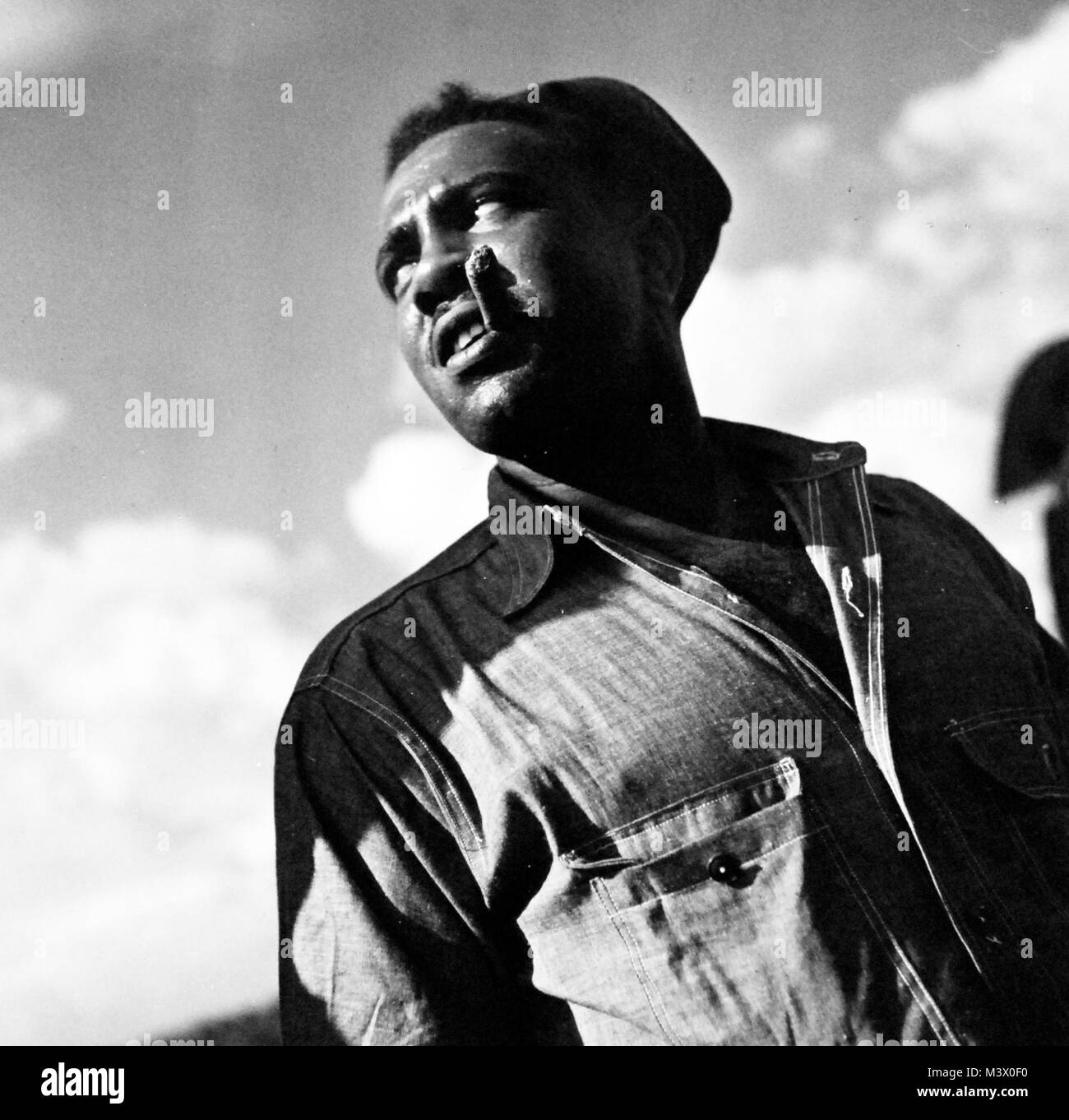 80-G-412869:  U.S. Naval Supply Depot, Guam, August 1945.  Sailor attached to the Depot.   Photographed by the Steichen Photographic Unit, TR-14967.  Official U.S. Navy Photograph, now in the collections of the National Archives.  (2018/01/31). 80-G-412869 25138158757 o Stock Photo
