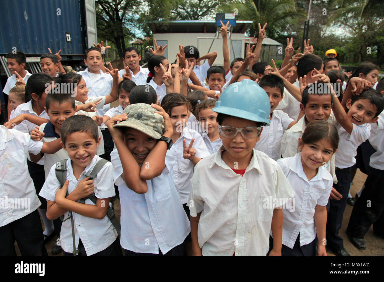Salvadoran schoolchildren pose for a picture in front of the newly