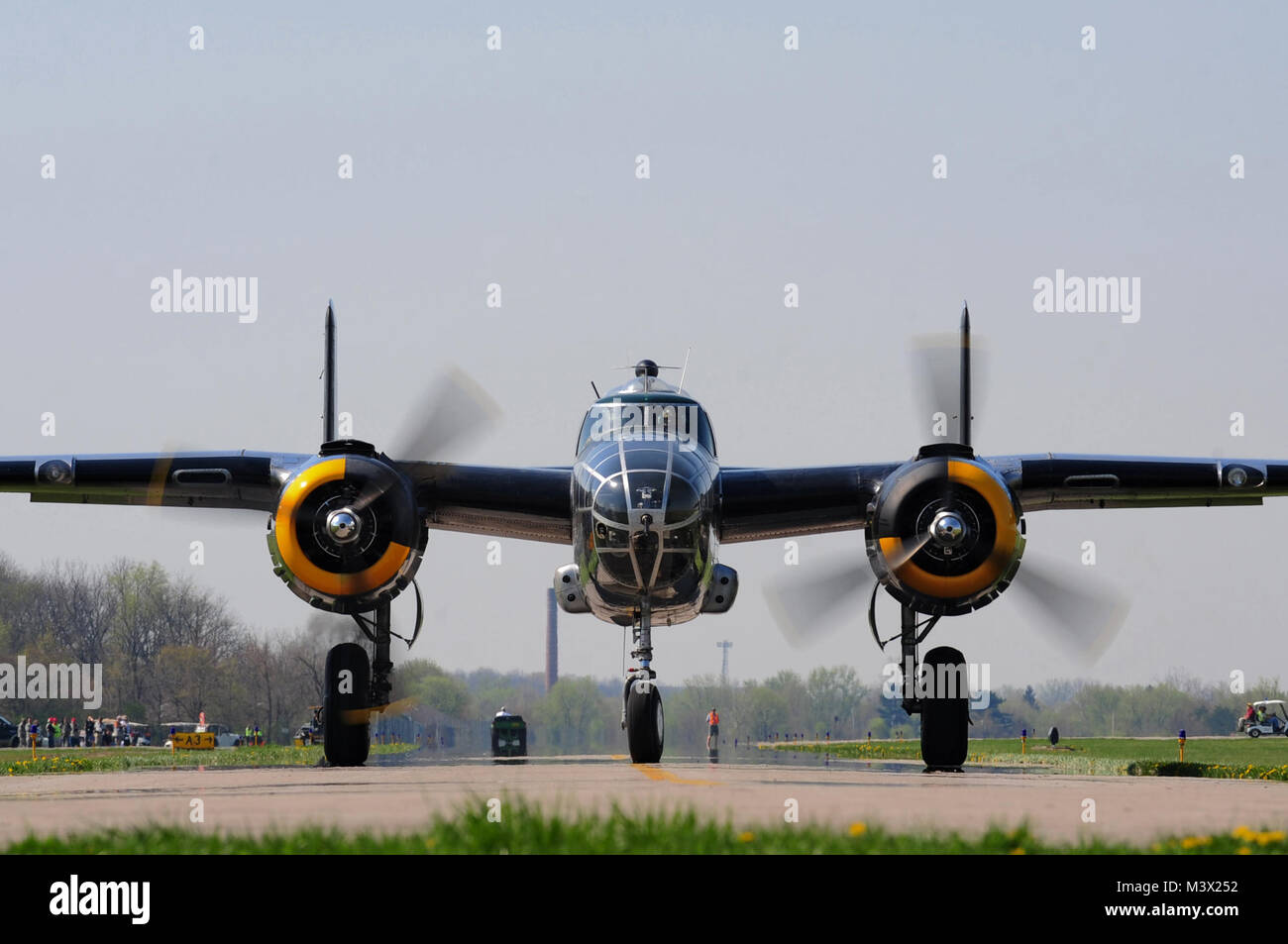 The 'Pacific Prowler,' a B-25 Mitchell Bomber, taxis the runway at Grimes Field, Ohio, April 15, 2010.  The B-25 crew flew from Fort Worth, Texas, to participate in commemoration flights for the Doolittle Raiders’ 68th reunion at Wright Patterson Air Force Base, Ohio.  The event honors the anniversary of the Doolittle Tokyo Raid.  On April 18, 1942, U.S. Army Air Forces Lt. Col. Jimmy Doolittle’s squad of 16 B-25s bombed targets over Japan in response to the Japanese attack on Pearl Harbor. (U.S. Air Force photo by Tech. Sgt. Jacob N. Bailey / Released) 100415-F-5964B-276 by AirmanMagazine Stock Photo