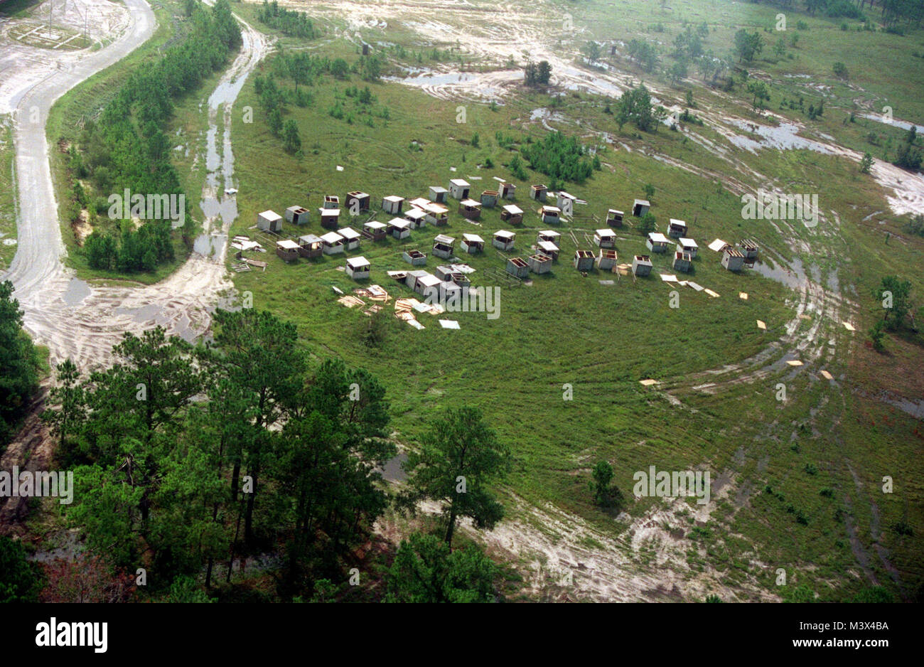 Aerial view of minor damage to one of Camp LeJeune's training areas