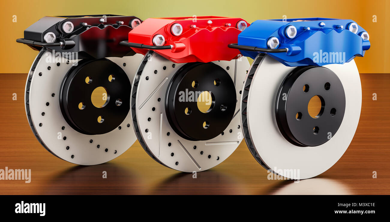 Set of car discs brake and calipers on the wooden table. 3D rendering